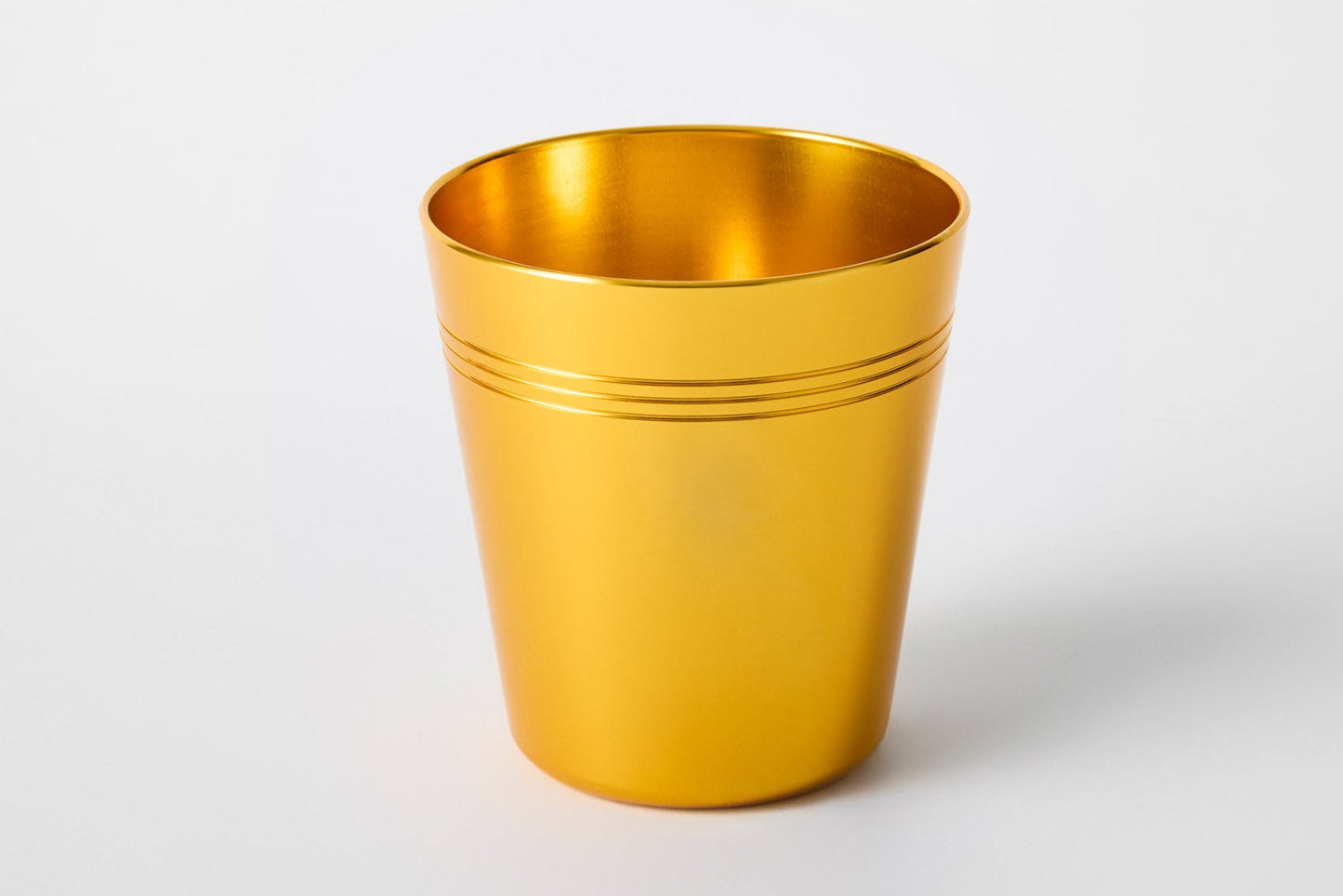 Gold anodised aluminium cup – sustainable, reusable drinkware by Maits