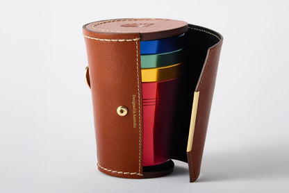 Set of 4 anodised aluminium cups stored in a premium leather case with gold opener – Maits