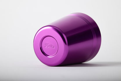 Purple anodised aluminium cup showing embossed Maits logo on base