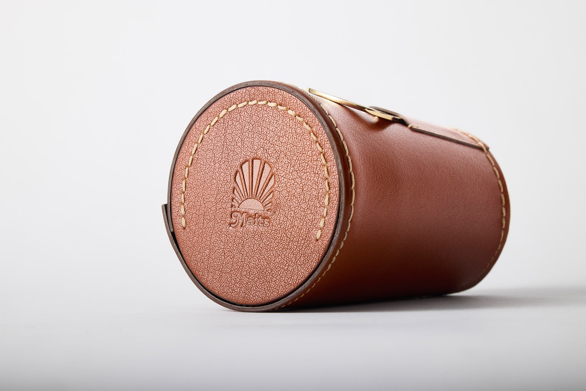 Close-up of Maits logo embossed on leather carry case for anodised aluminium cups